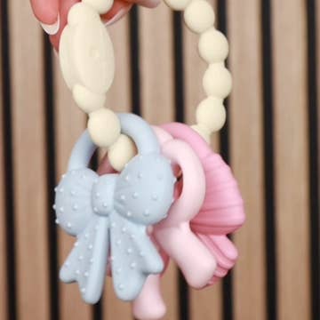 Itzy Trio™ 100% Silicone Multi-Textured Teether- Bows