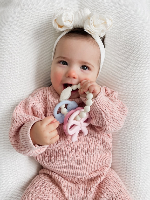 Itzy Trio™ 100% Silicone Multi-Textured Teether- Bows